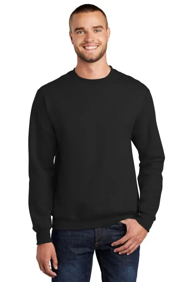 A man wearing black sweatshirt with jeans.