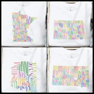 Four t-shirts with different colored designs on them.