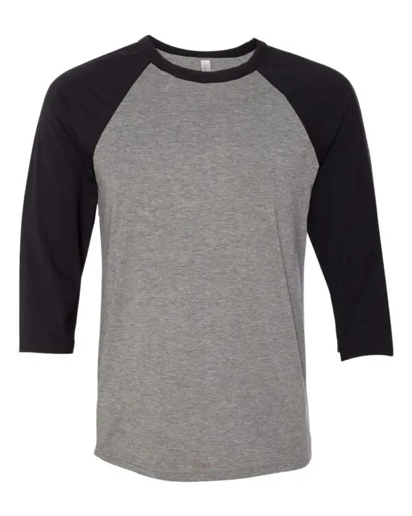 A gray and black shirt is shown on the ground.