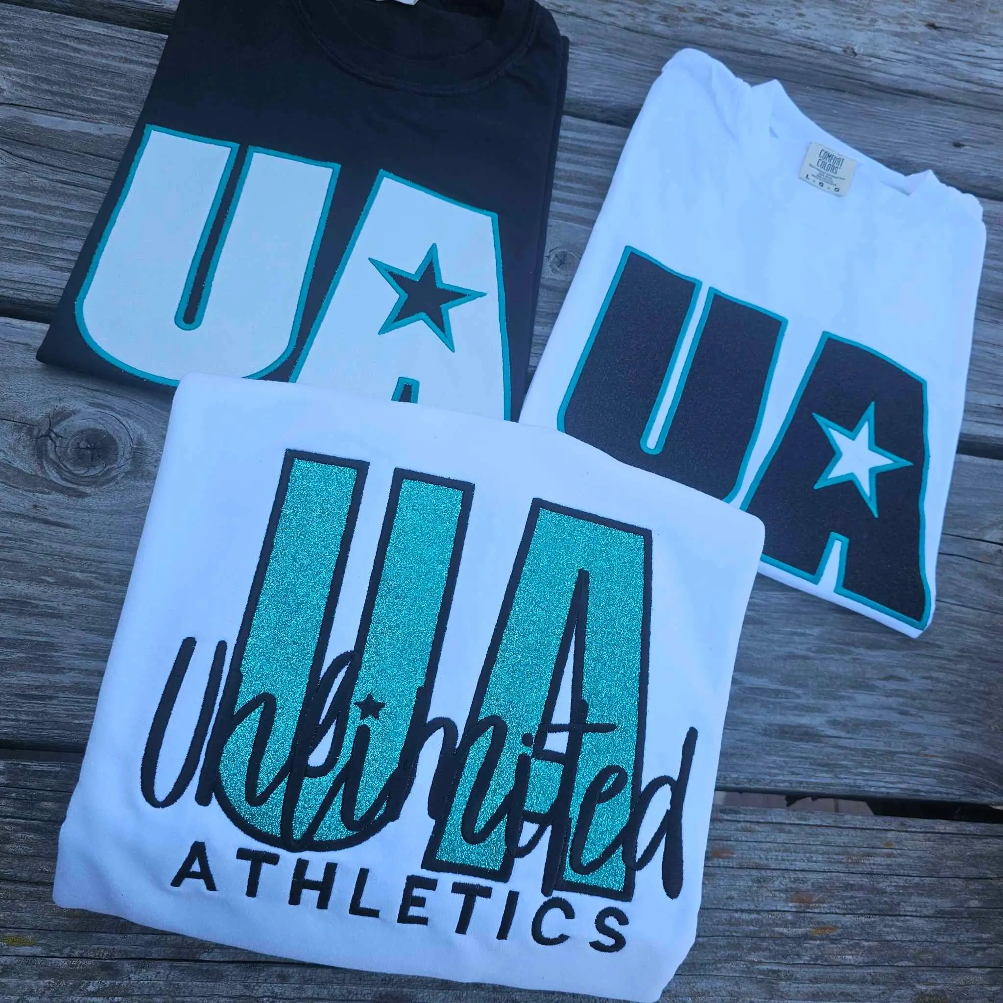 Three different shirts that are on a table.