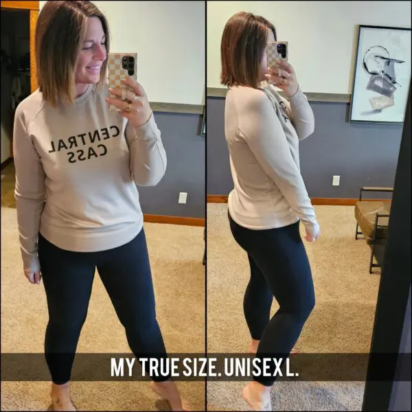 A woman taking a selfie in front of the mirror.