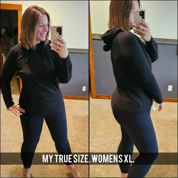 A woman taking a selfie in front of her mirror.