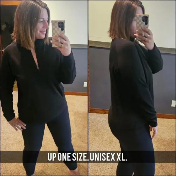 A woman taking a selfie in front of the mirror.