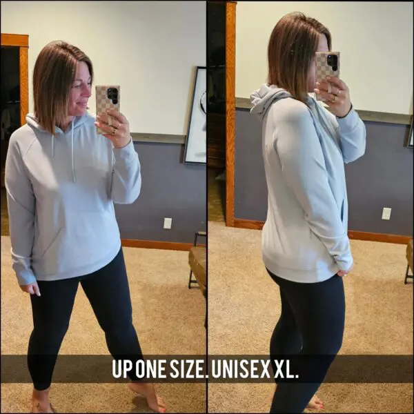 A woman taking a selfie in front of the mirror.
