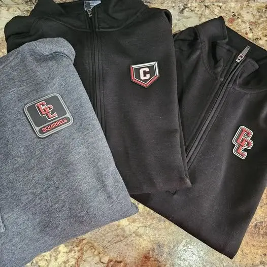 Three jackets are shown with patches on them.