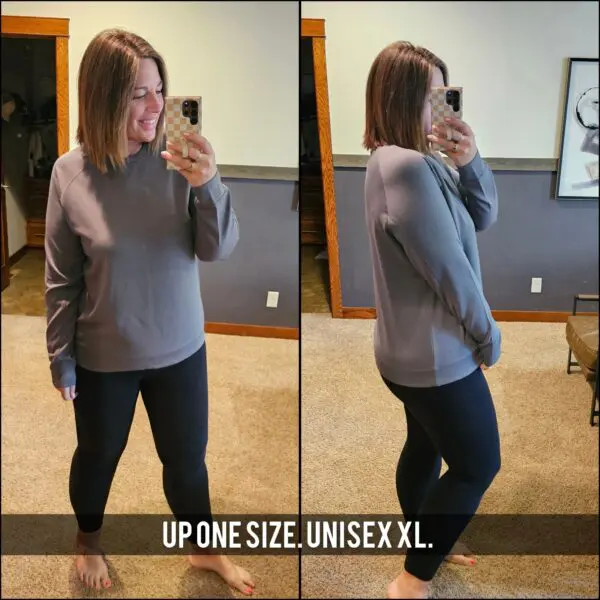A woman taking a selfie in front of the mirror.