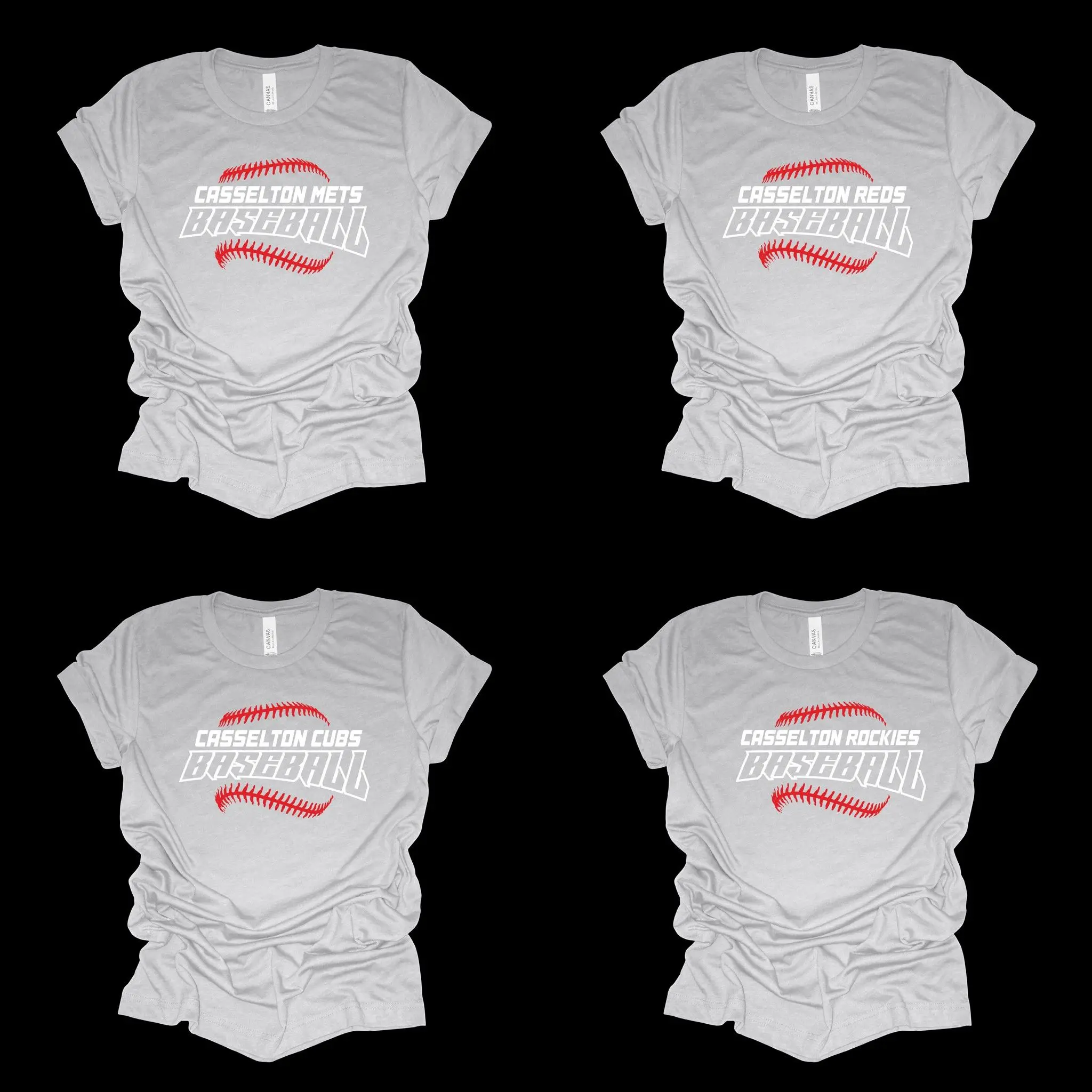A group of four white shirts with faces on them.