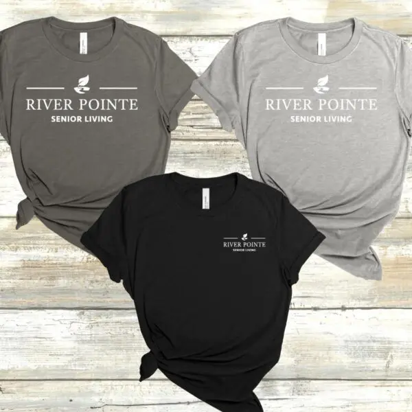 Three different colored shirts with river pointe logo.