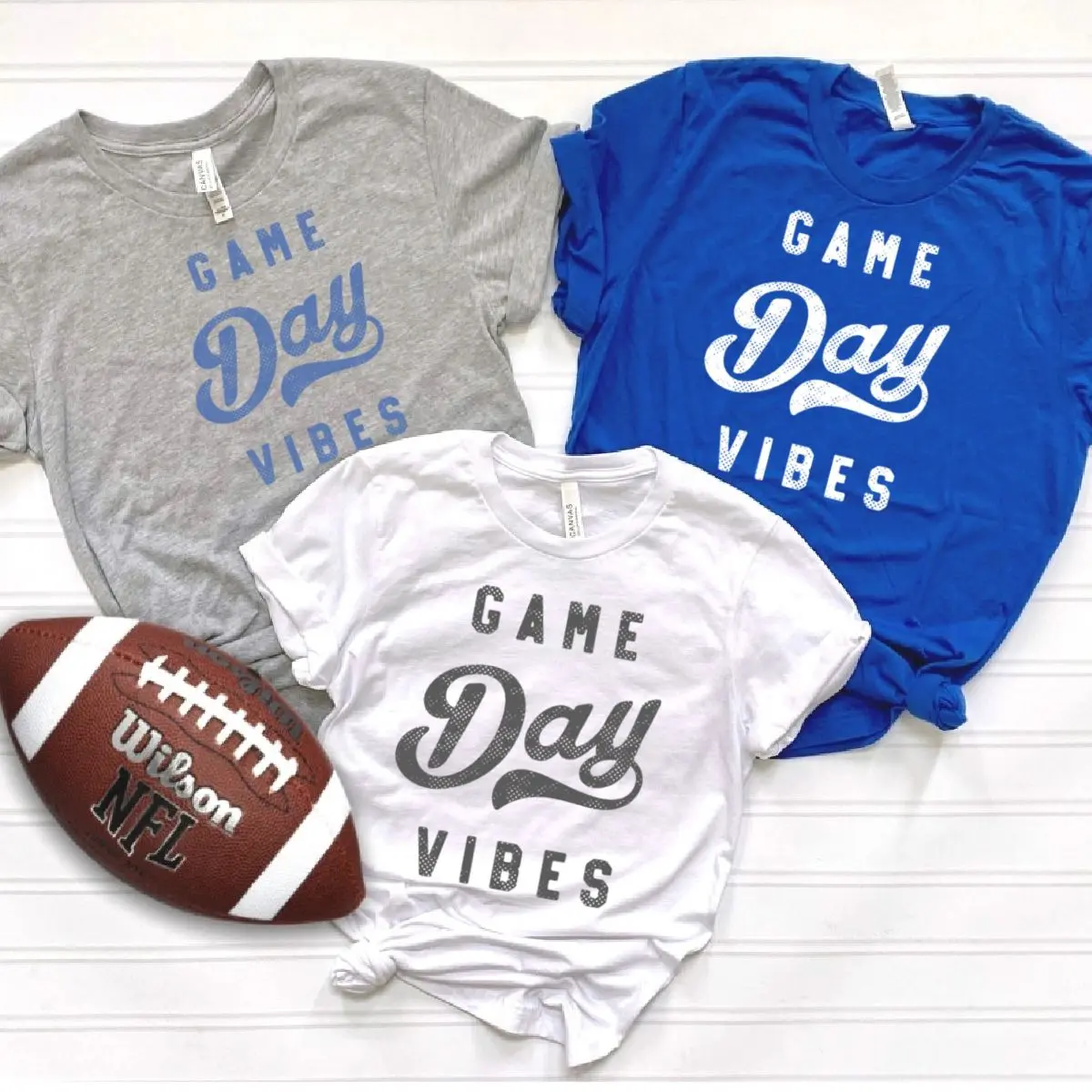 Facebook-Post-2023-08-08T154342.133 A football and some shirts that say game day vibes