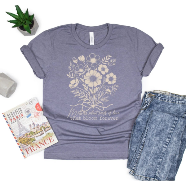 A t-shirt with flowers and the words " live life to the fullest ".