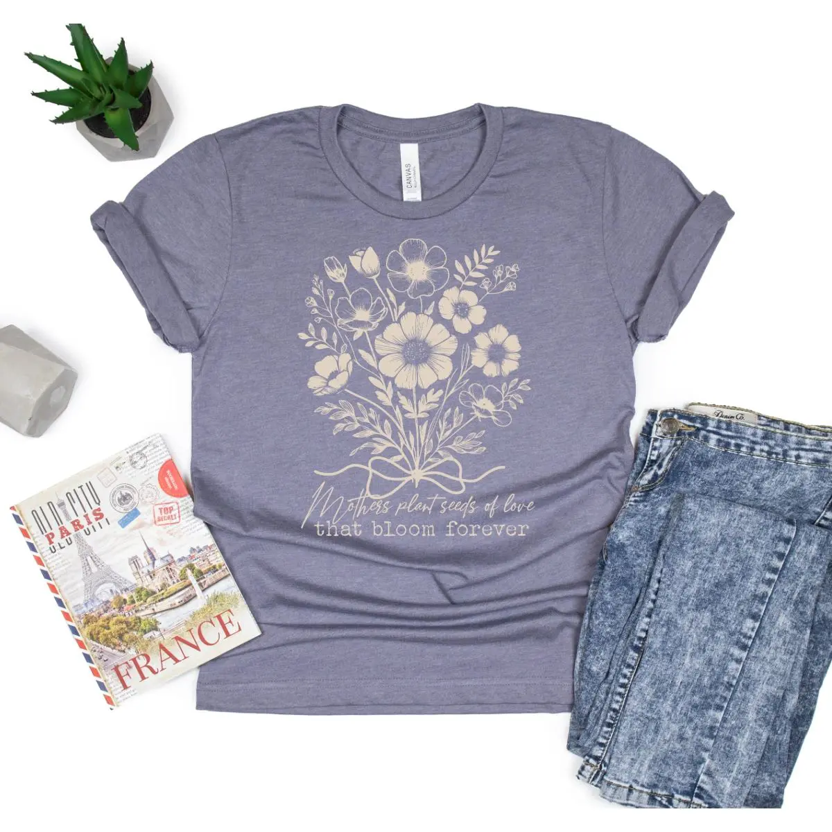A t-shirt with flowers and the words " live life to the fullest ".