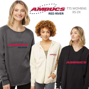Three women wearing different colors of shirts and one woman is holding a black shirt.