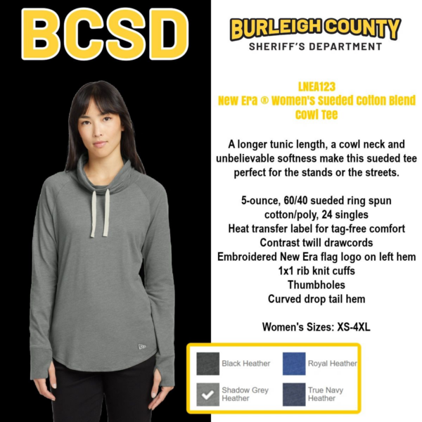A woman wearing a gray hoodie with the words " bcsd " on it.