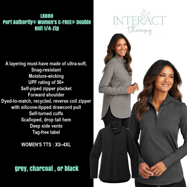 A woman wearing a gray jacket and black pants.