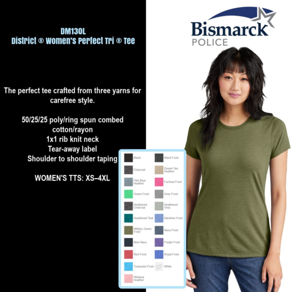 A woman wearing a green shirt and black pants.
