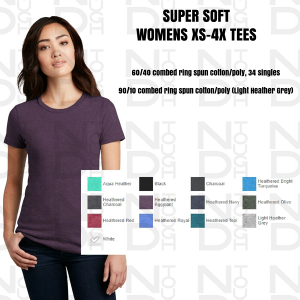 A woman wearing a purple shirt and jeans.