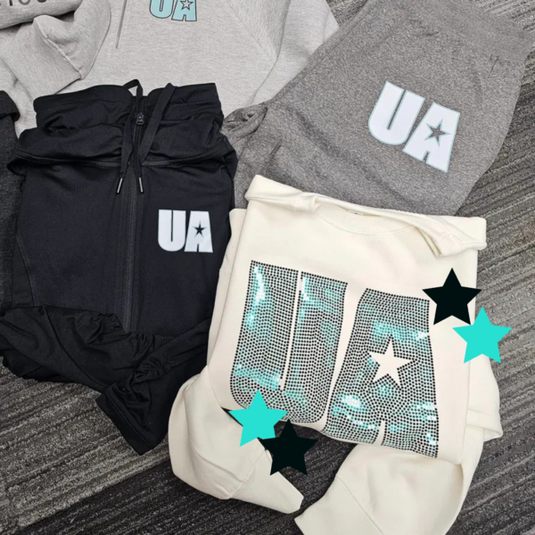 A group of clothes that are on the ground.