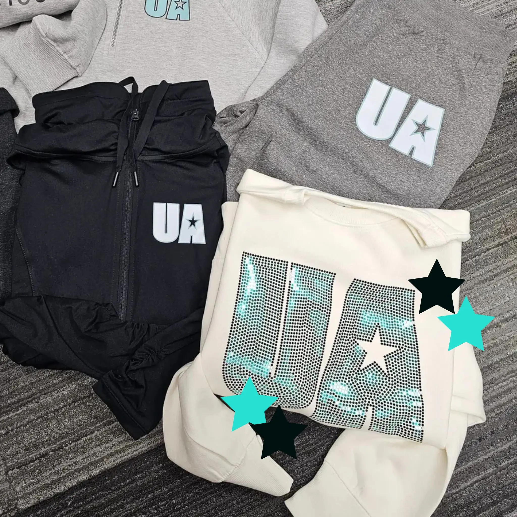 A group of clothes that are on the ground.