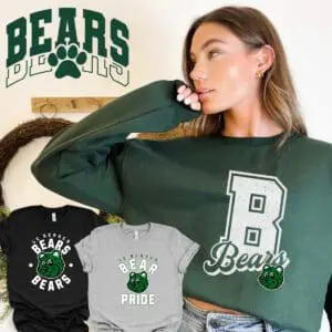Woman wearing green Bears sweatshirt, casual style.