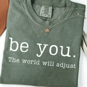 Gray shirt with "be you" message.