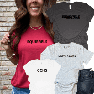 Woman wearing "SQUIRRELS" shirt, holding others.