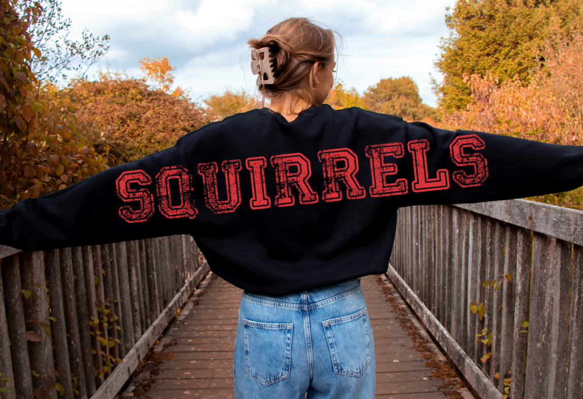Person on bridge wearing SQUIRRELS sweatshirt
