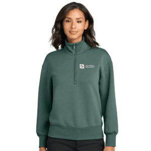 Woman wearing green quarter-zip with logo