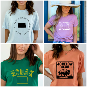 Four women wearing North Dakota-themed graphic t-shirts