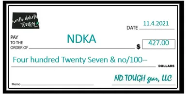 A cheque that is in front of the words ndka.